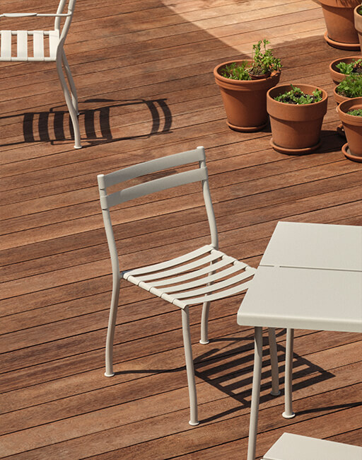 White Baltic conference chairs on a swivel base, one with a writing tablet