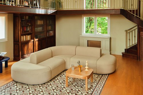 Modular sofa in a vibrant blue colour with built-in side tables