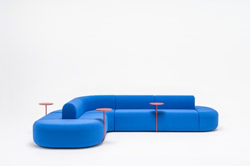 Modular sofa in a vibrant blue colour with built-in side tables